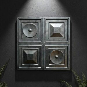 Modern metallic wall panel design featuring four decorative square panels with geometric and circular embossed details on a dark textured wall.
