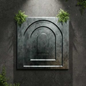 Modern metallic wall panel with layered arch design in a dark textured finish, surrounded by green foliage.