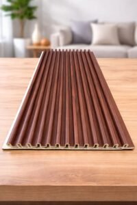 Brown wooden fluted wall panel with a modern grooved design displayed on a table