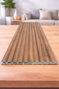 Wood finish fluted wall panel with vertical grooves displayed on a wooden surface.