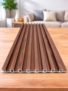 Walnut wood-finish fluted WPC panel displayed on a wooden tabletop in a modern living room.