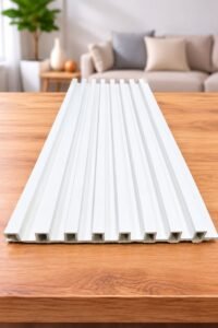 White grooved wall panel displayed on a wooden table in a modern living room.