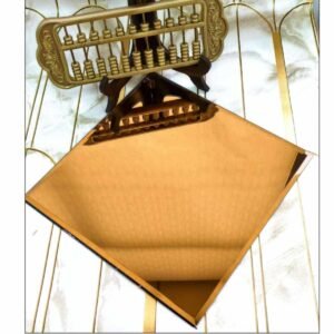 golden decorative sheet with a subtle textured pattern displayed on a sample board.