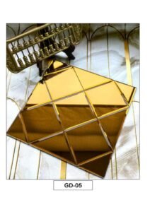 golden geometric mosaic tiles with a glossy metallic finish and faceted diamond pattern.