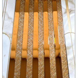 golden decorative fluted wall panel with textured geometric strips