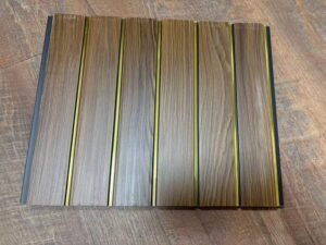 Brown wood-textured fluted wall panel with vertical golden strips