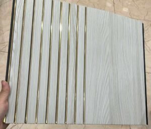 White wood-textured fluted panel with gold accent lines