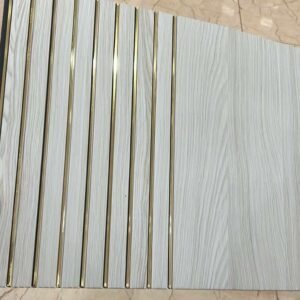 White wood-textured fluted panel with gold accent lines