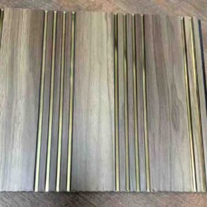 Grey wood-texture fluted wall panel with multiple vertical grooves and decorative gold metallic strips.