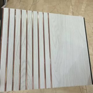 White marble finish fluted wall panel with rose gold vertical lines