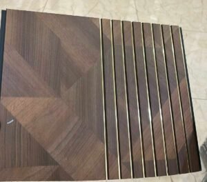 Brown wood-finish fluted panel with geometric pattern and elegant golden strips