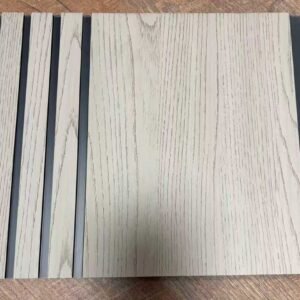 Light beige wood-texture decorative wall panel with vertical grooves and subtle dark grain detailing.