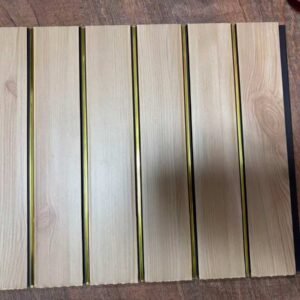 Light natural wood-finish fluted wall panel with vertical golden strips
