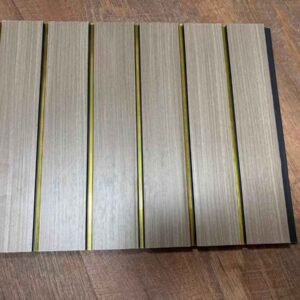Light wood-finish fluted wall panel with vertical golden strips